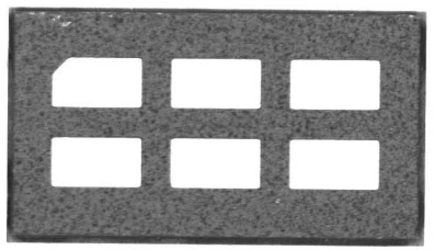 Magnified inspection image of a packaged optical component with multiple apertures.
