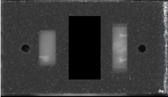 A second component inspection view with the central code region masked in the inspection image.