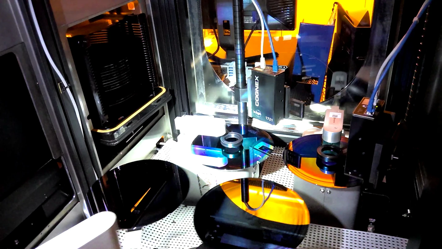 Vision cameras observing wafers inside semiconductor equipment.